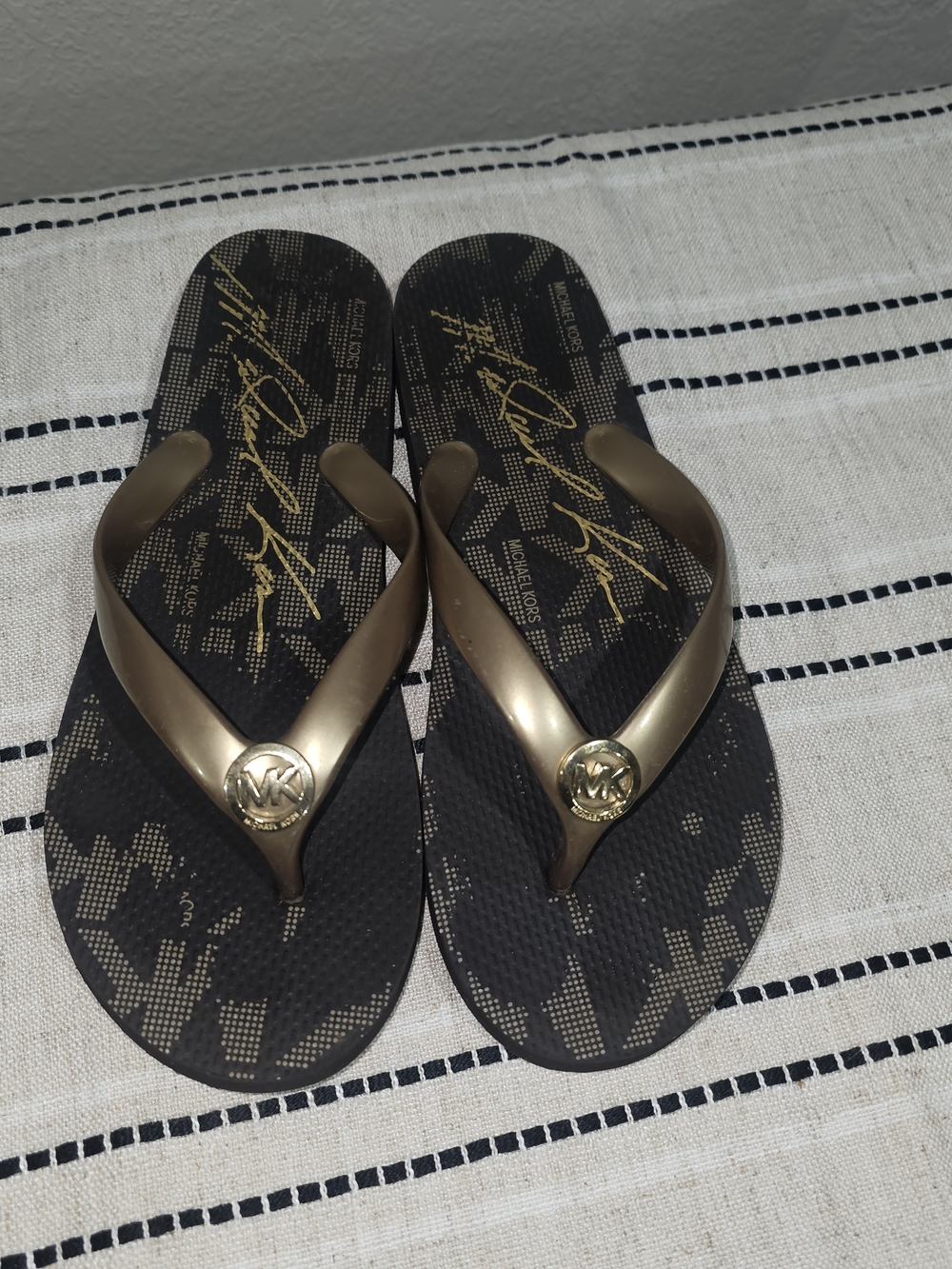 Michael Kors Black Flip Flops with Gold Logo Accents